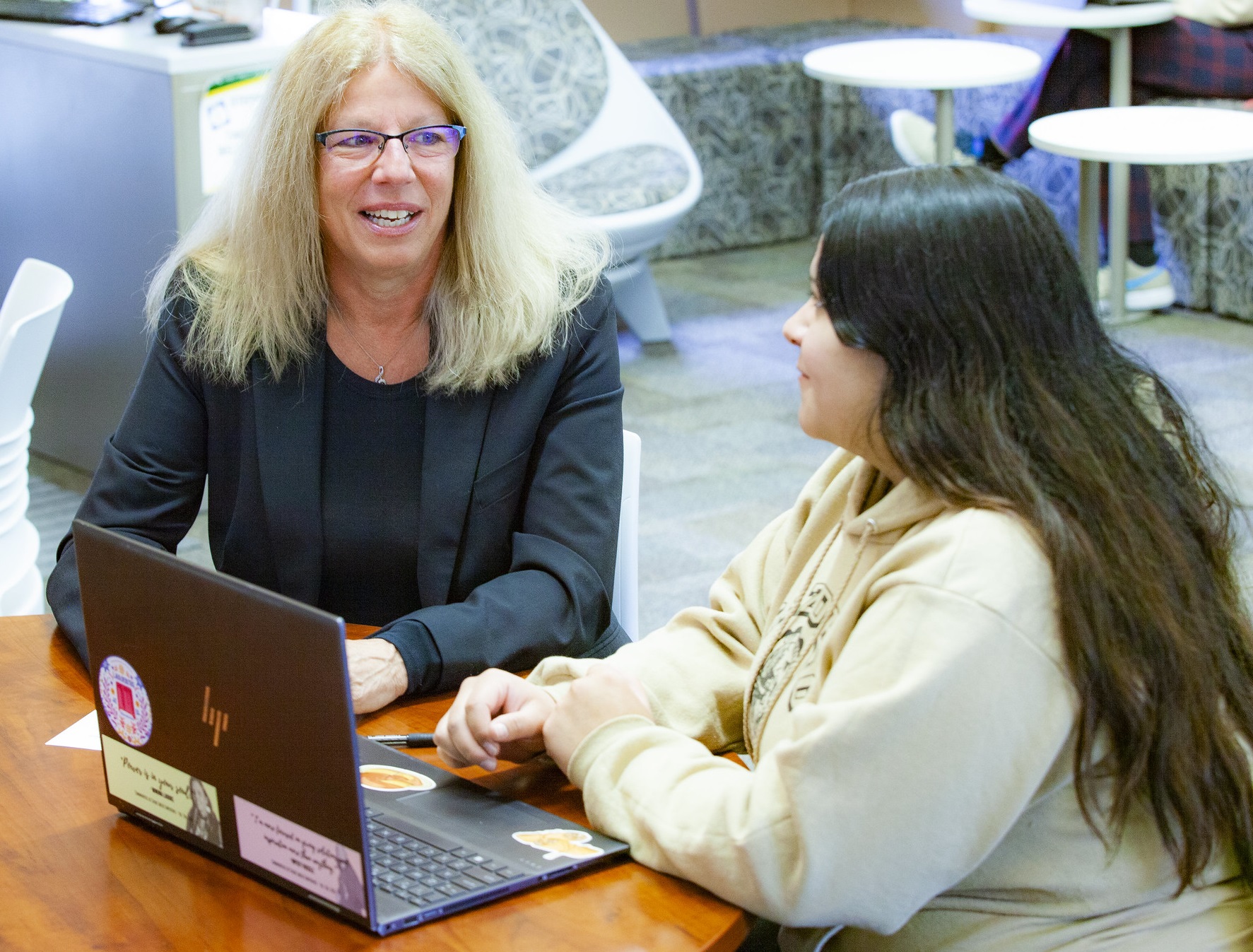 WIOA and work experience program coordinator Robin Heinemann meets with a student.