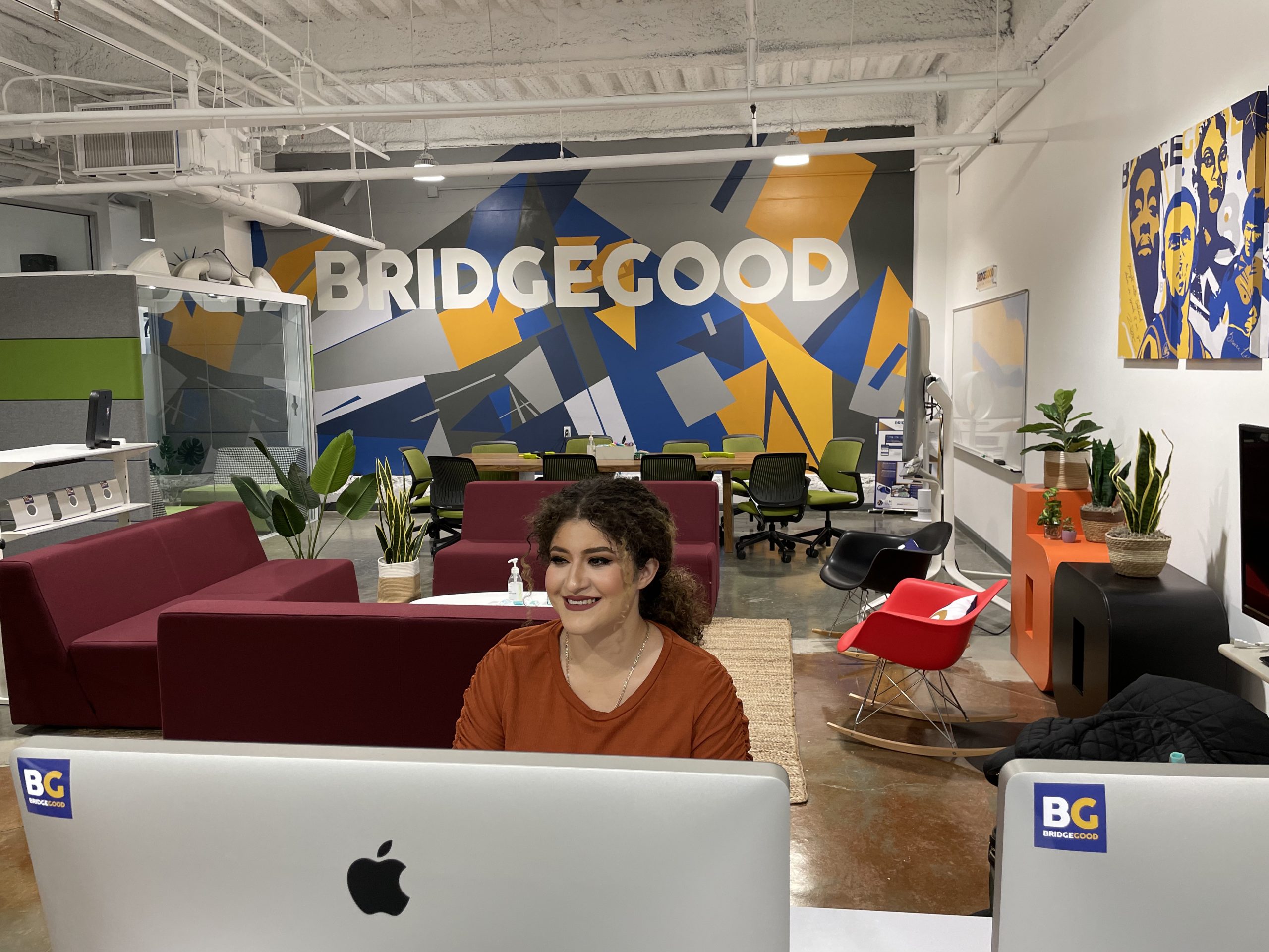 Yudy Herrera Orellana at her desk at BRIDGEGOOD